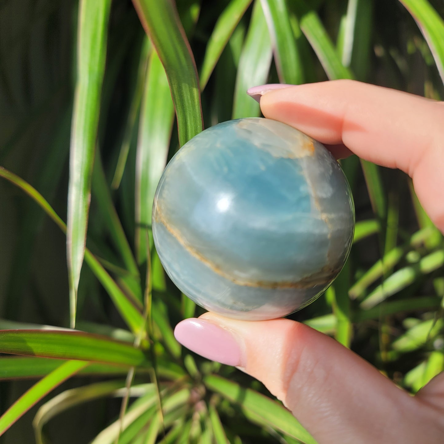 Blue Onyx Sphere: A Gemstone of Strength and Serenity