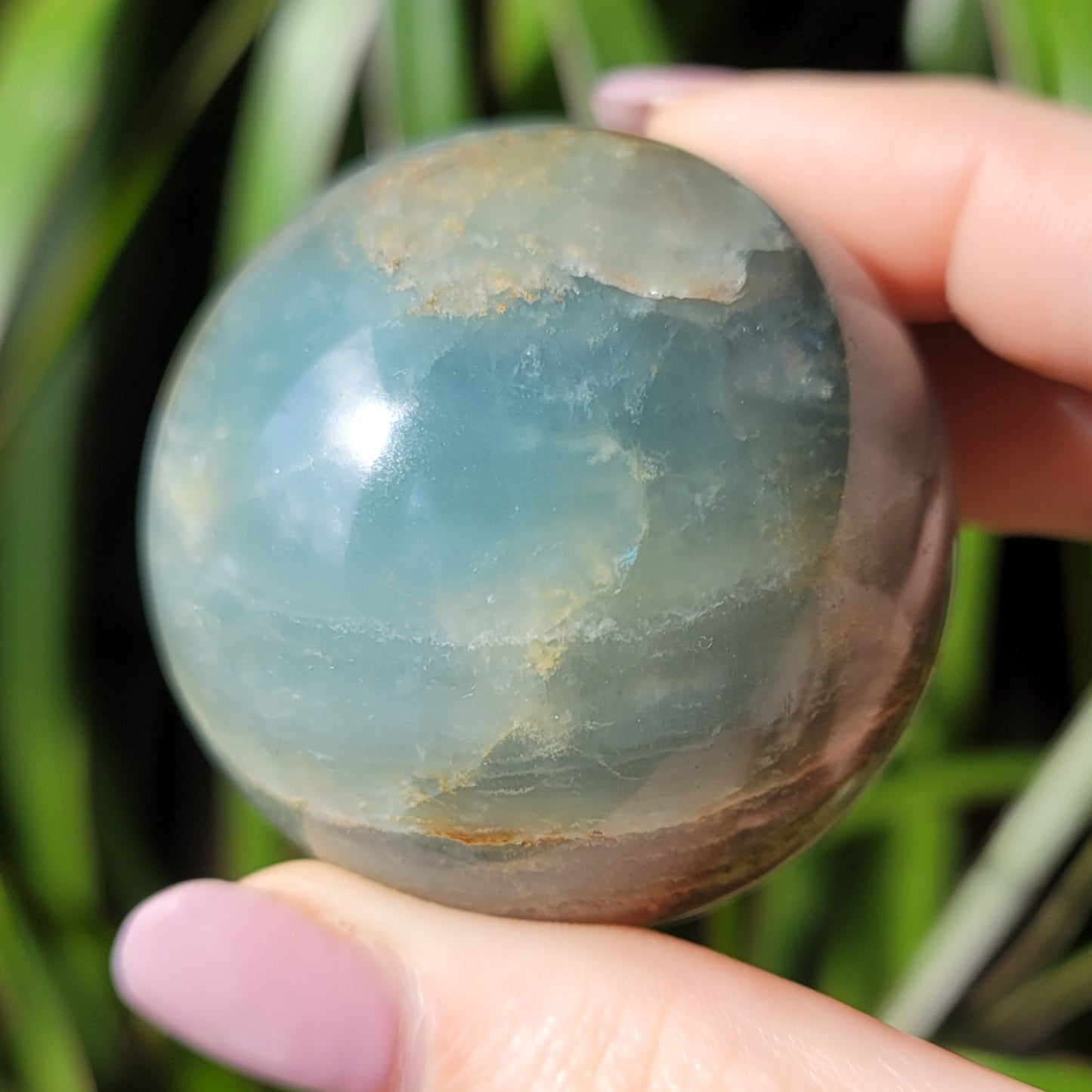 Blue Onyx Sphere: A Gemstone of Strength and Serenity