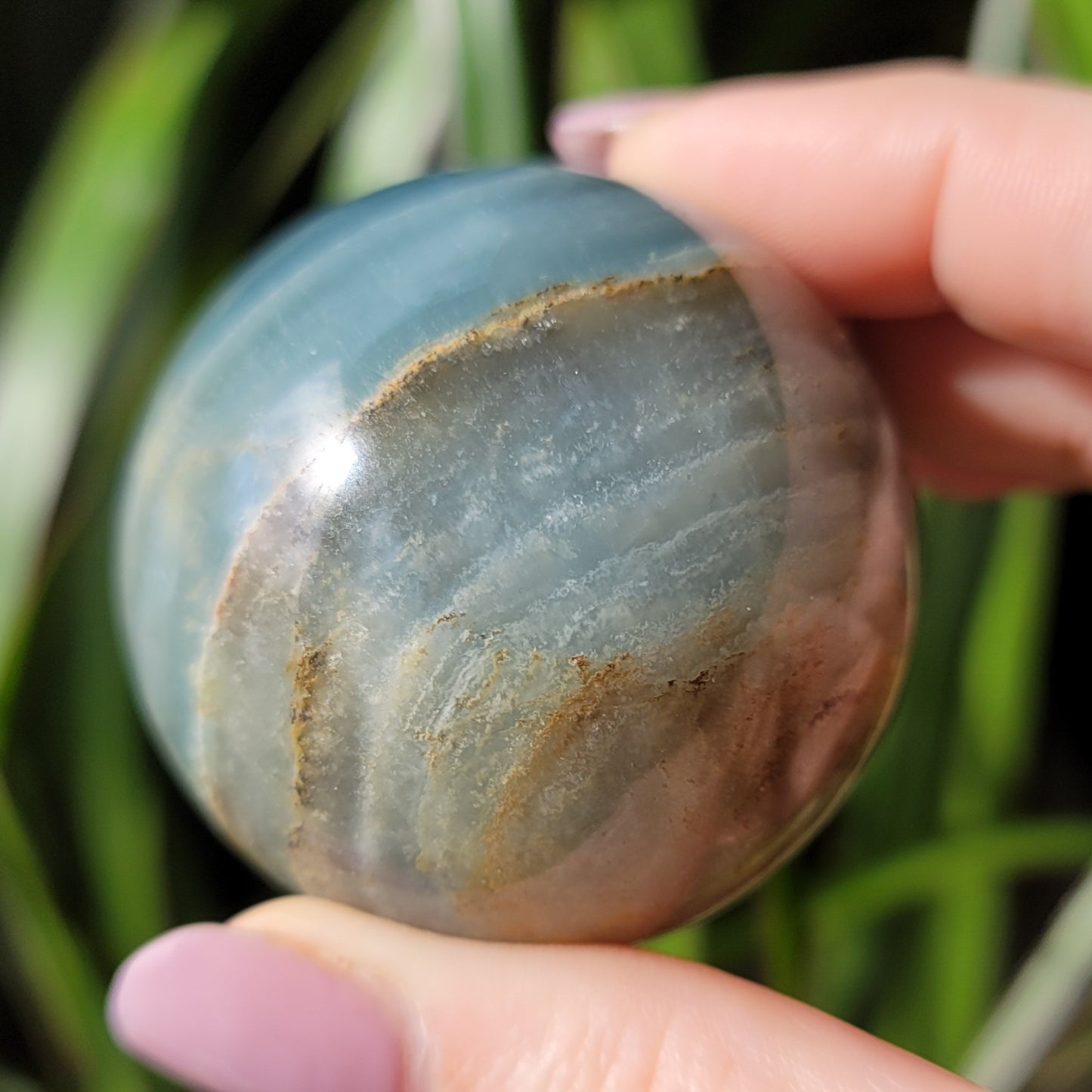 Blue Onyx Sphere: A Gemstone of Strength and Serenity