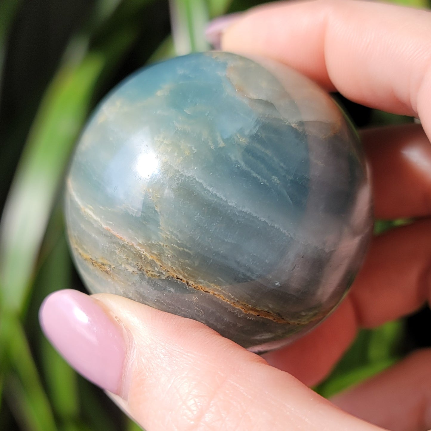 Blue Onyx Sphere: A Gemstone of Strength and Serenity