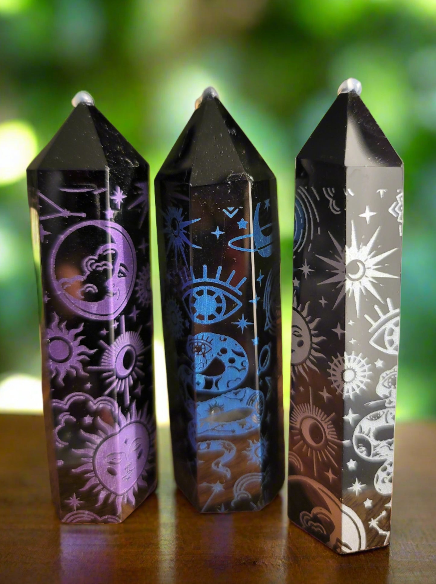 3 obisidian points with different color etching, purple blue and silver