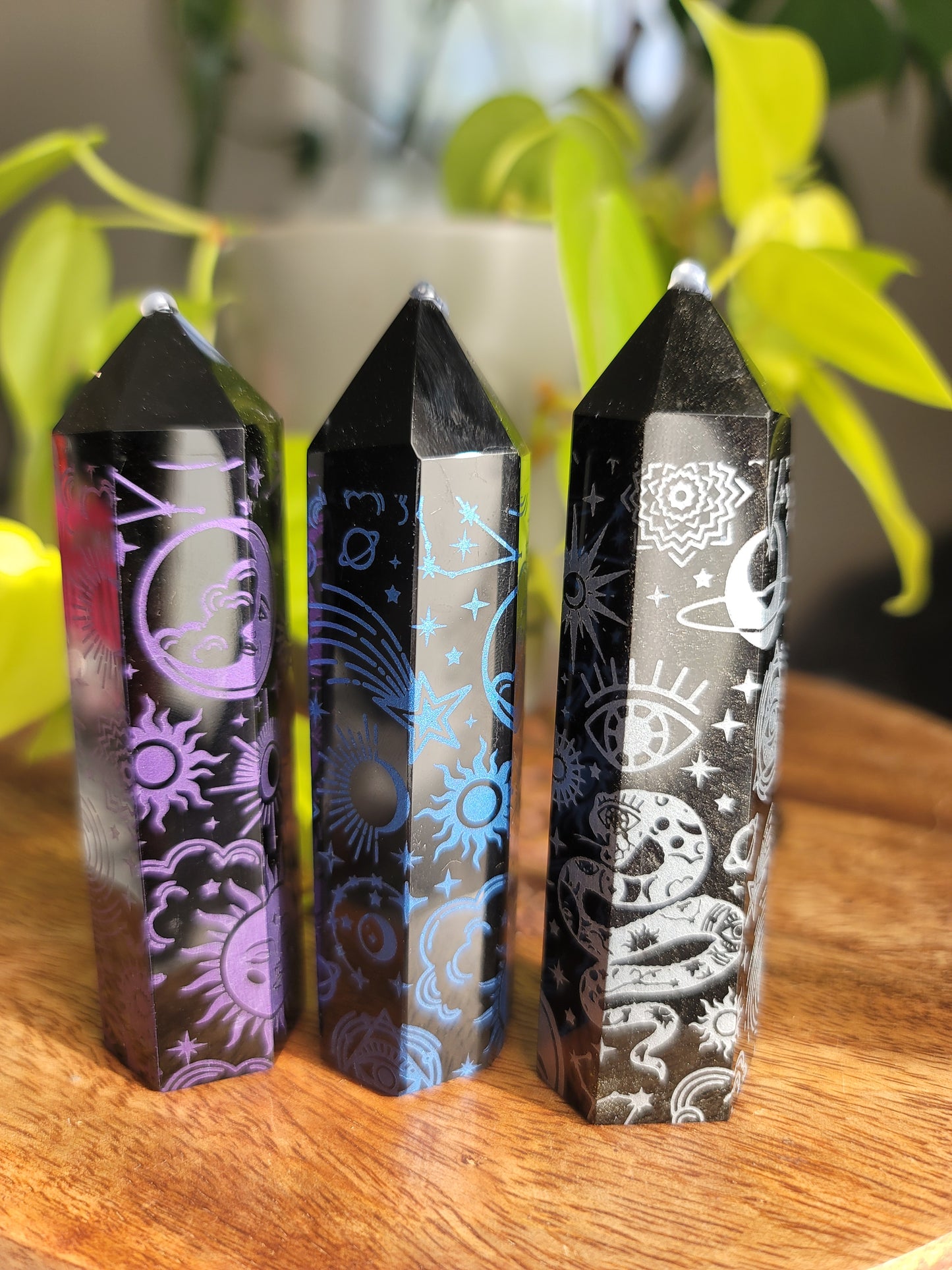 3 obisidian points with different color etching, purple blue and silver