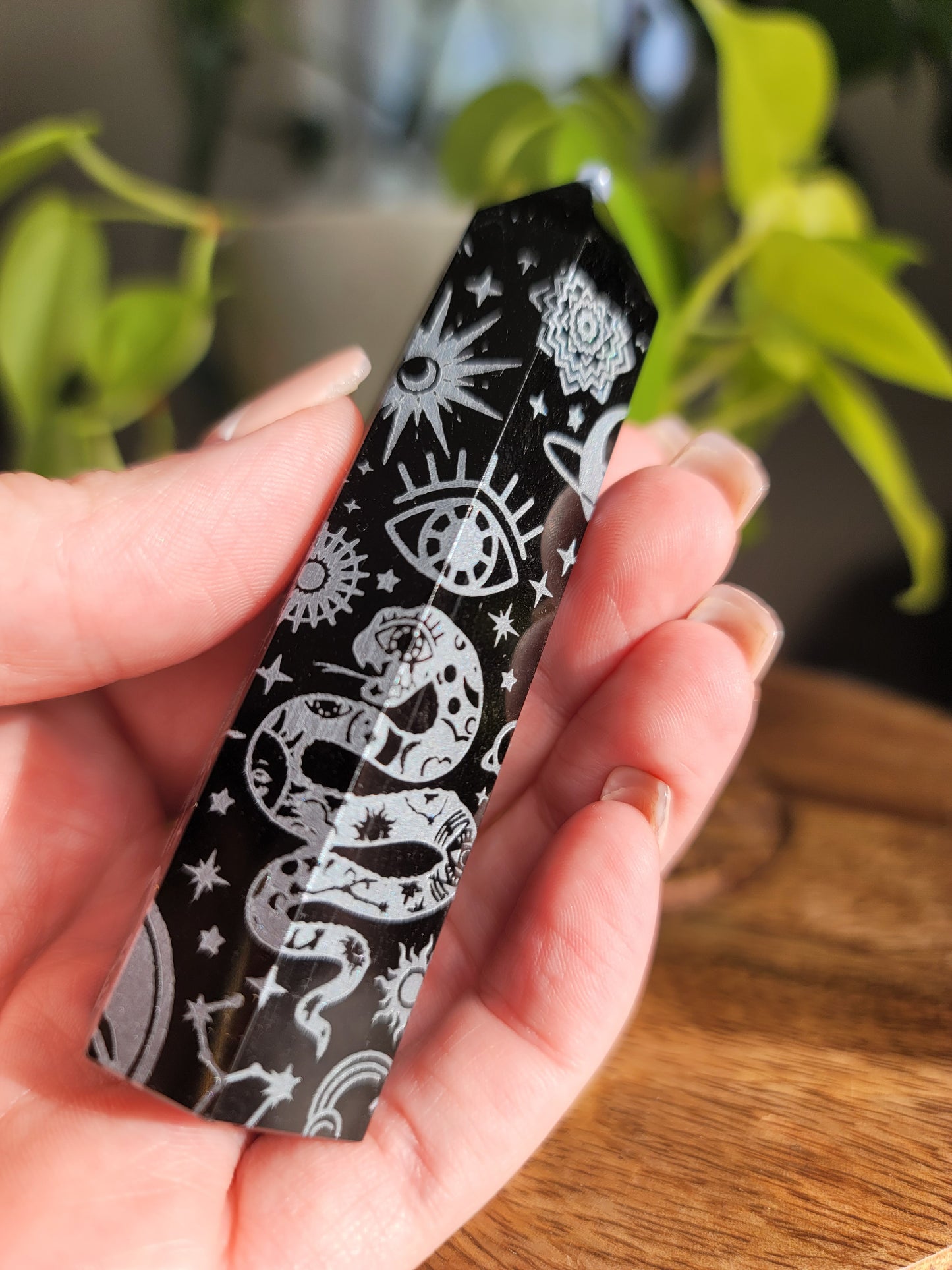 silver obisidian points with etchings of images