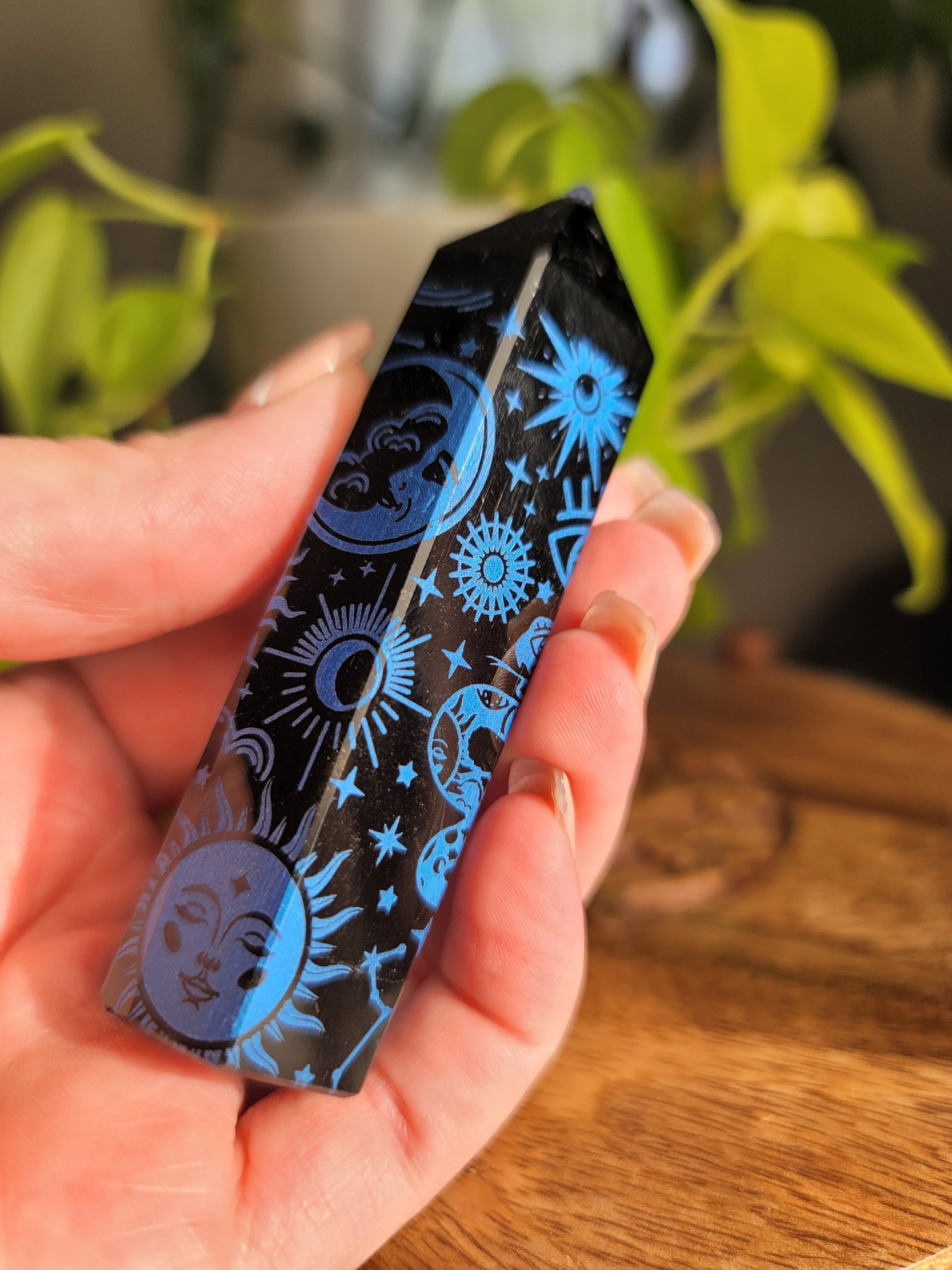 blue obisidian points with etchings of images
