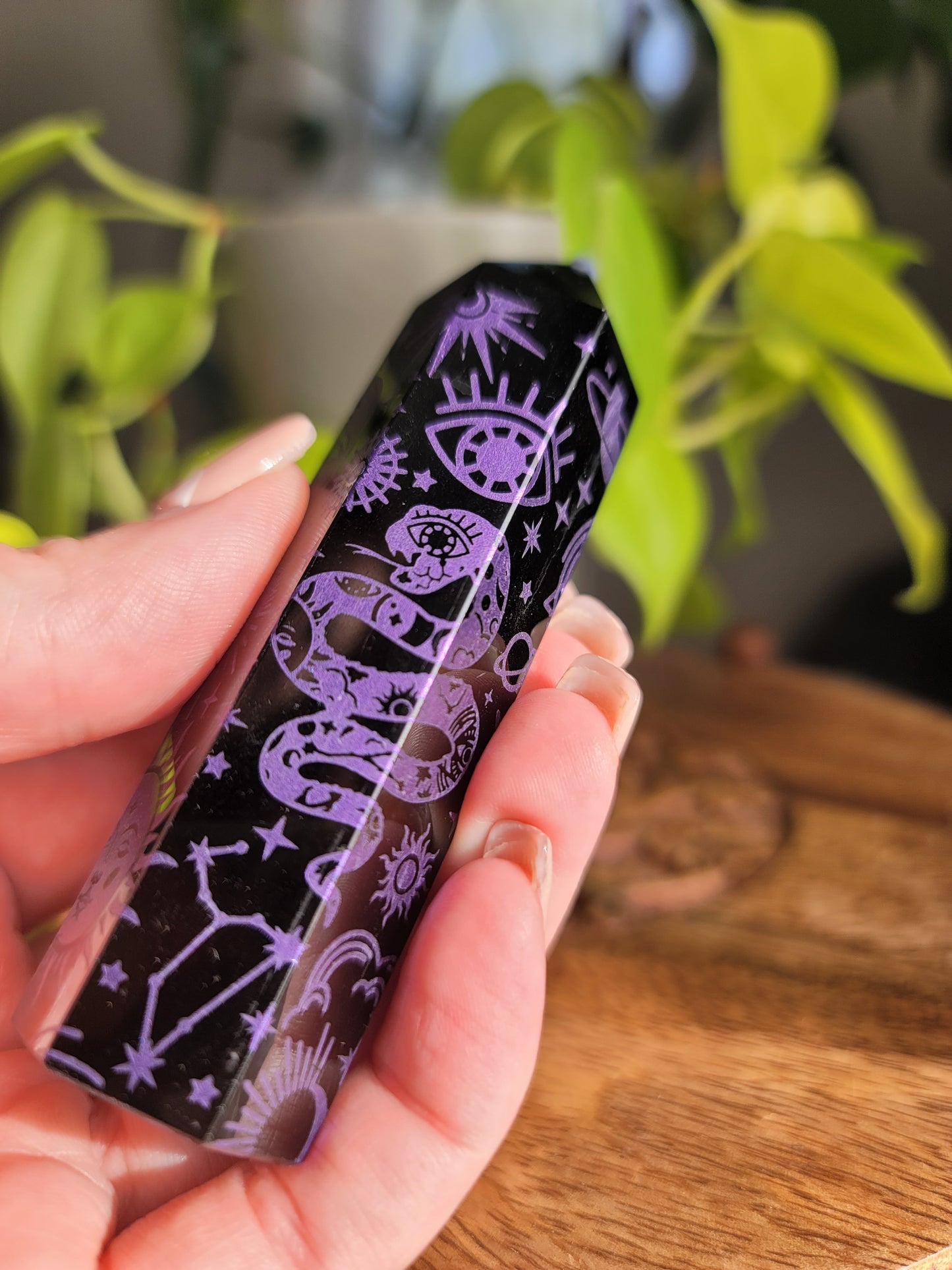 purple obisidian points with etchings of images