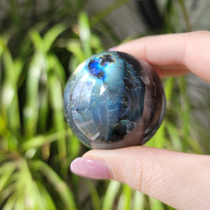 Labradorite Sphere: Mystical Radiance and Cosmic Harmony