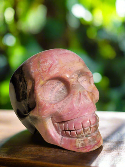 Rhodonite Skull Carving - pink and brown