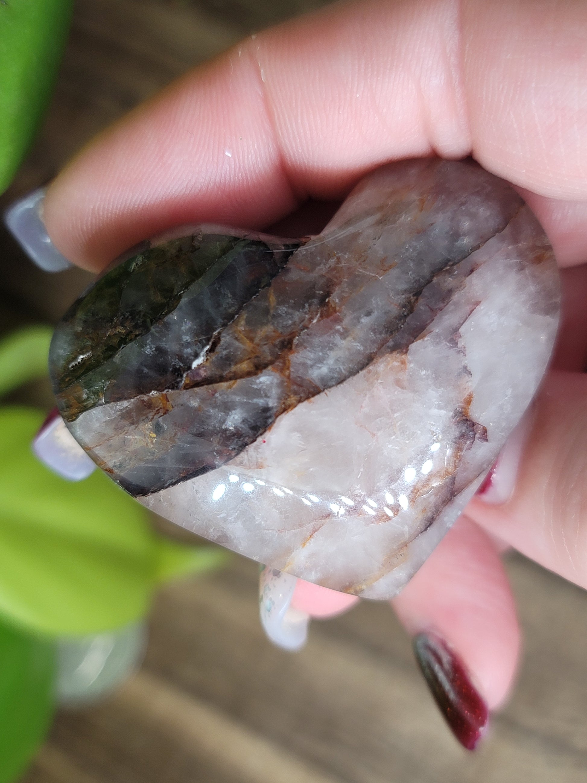 fire quartz puffy heart carving in hand
